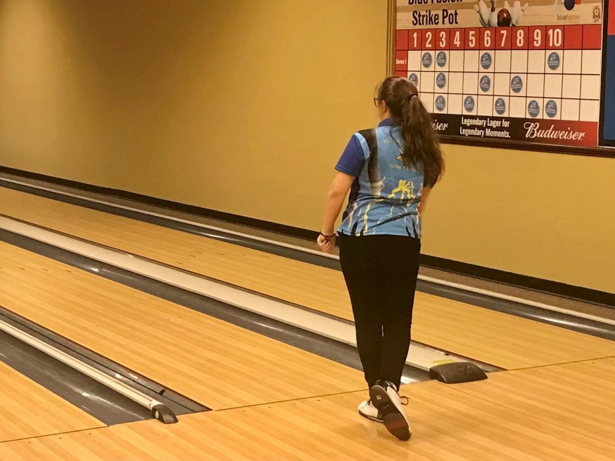 River Valley's Alexis Manning watches a shot during a girls bowling match against Pleasant at BlueFusion last season.