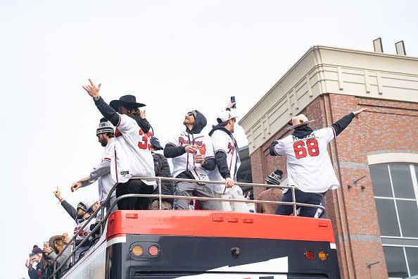 ATLANTA, GA - NOVEMBER 05: Members of the Atlanta Braves cheer during the World Series Parade at Truist Park on November 5, 2021 in Atlanta, Georgia. The Atlanta Braves won the World Series in six games against the Houston Astros winning their first championship since 1995. (Photo by Megan Varner/Getty Images)