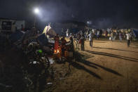 Tigray people who fled the conflict in Ethiopia's Tigray region, gather near their shelters at Umm Rakouba refugee camp in Qadarif, eastern Sudan, Thursday, Nov. 26, 2020. Ethiopia's prime minister said Thursday the army has been ordered to move on the embattled Tigray regional capital after his 72-hour ultimatum ended for Tigray leaders to surrender, and he warned the city's half-million residents to stay indoors and disarm. (AP Photo/Nariman El-Mofty)