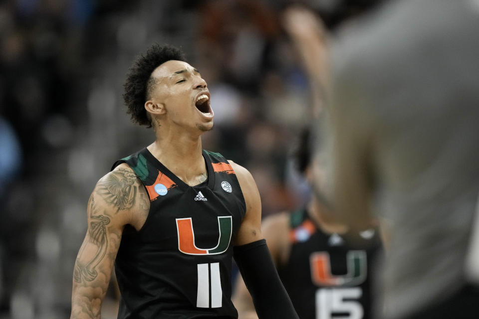 Miami guard Jordan Miller celebrates after scoring against Texas in the second half of an Elite 8 college basketball game in the Midwest Regional of the NCAA Tournament Sunday, March 26, 2023, in Kansas City, Mo. (AP Photo/Charlie Riedel)