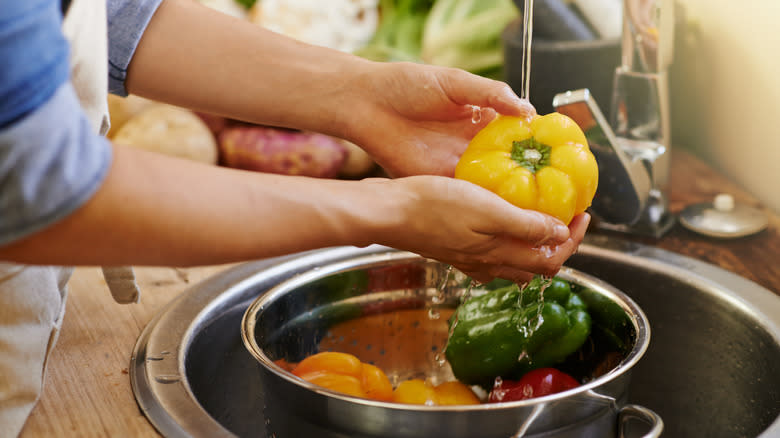 Person washing produce