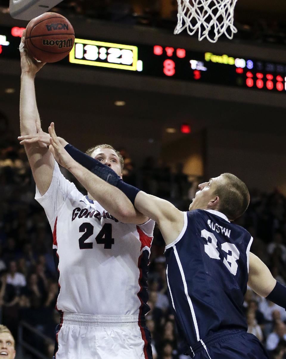 Gonzaga's Przemek Karnowski (24) puts up a shot against BYU's Nate Austin (33) in the first half of the NCAA West Coast Conference tournament championship college basketball game, Tuesday, March 11, 2014, in Las Vegas. (AP Photo/Julie Jacobson)