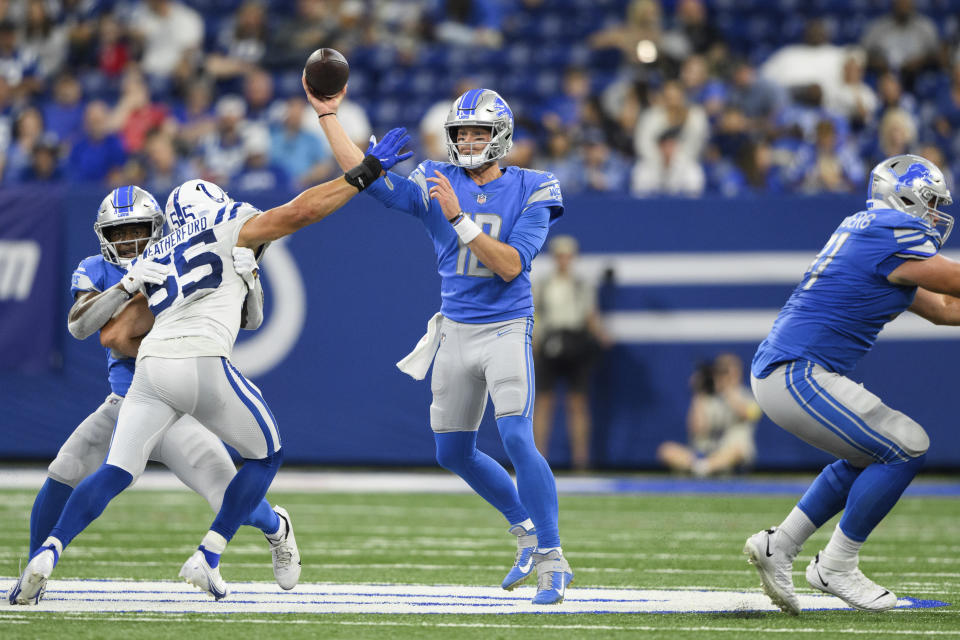 FILE - Detroit Lions quarterback Tim Boyle (12) throws over Indianapolis Colts linebacker Sterling Weatherford (55) during an NFL football game Aug. 20, 2022, in Indianapolis. The New York Jets signed Boyle, Thursday, April 6, 2023, to a one-year contract to serve as a backup with experience playing in offensive coordinator Nathaniel Hackett's system. (AP Photo/Zach Bolinger, File)