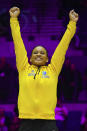 Gold medalist Rebeca Andrade of Brazil celebrates during a medal ceremony for the Women's All-Around Final during the Artistic Gymnastics World Championships at M&S Bank Arena in Liverpool, England, Thursday, Nov. 3, 2022. (AP Photo/Jon Super)
