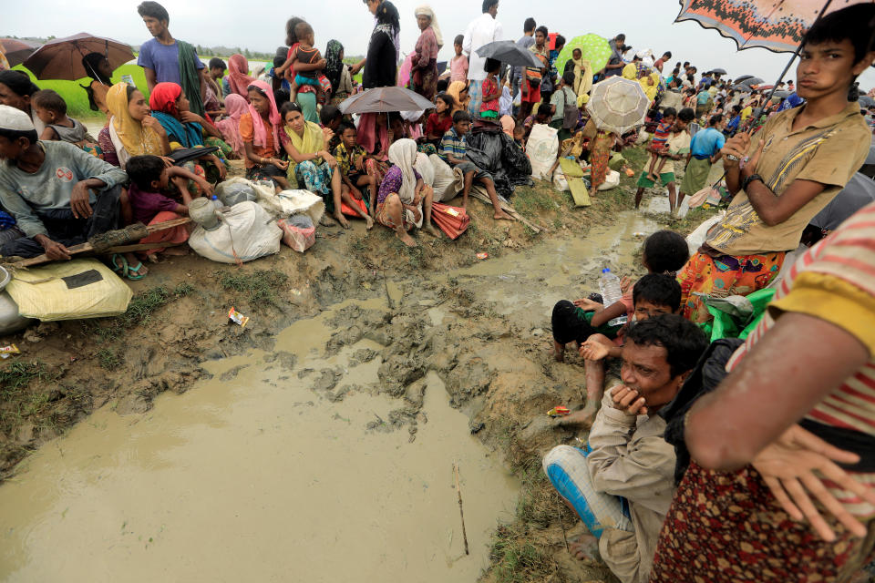 Rohingya refugees who fled from Myanmar wait to be let into&nbsp;Bangladesh on Oct. 16. (Photo: Zohra Bensemra/Reuters)