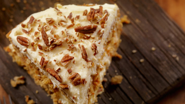 Carrot cake with frosting with nuts