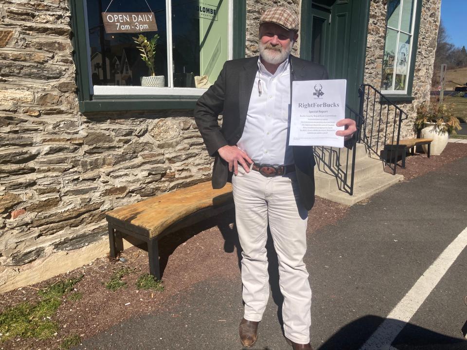 Andy Meehan, at the Johnson Hall Coffee House in Hulmeville, holds a copy of his report on the inner-workings of the Bucks County GOP. He said the party's establishment uses antiquated by-laws to keep committee seat empty in Lower Bucks, preventing a two-thirds quorum needed to update the by-laws adopted in 1972.