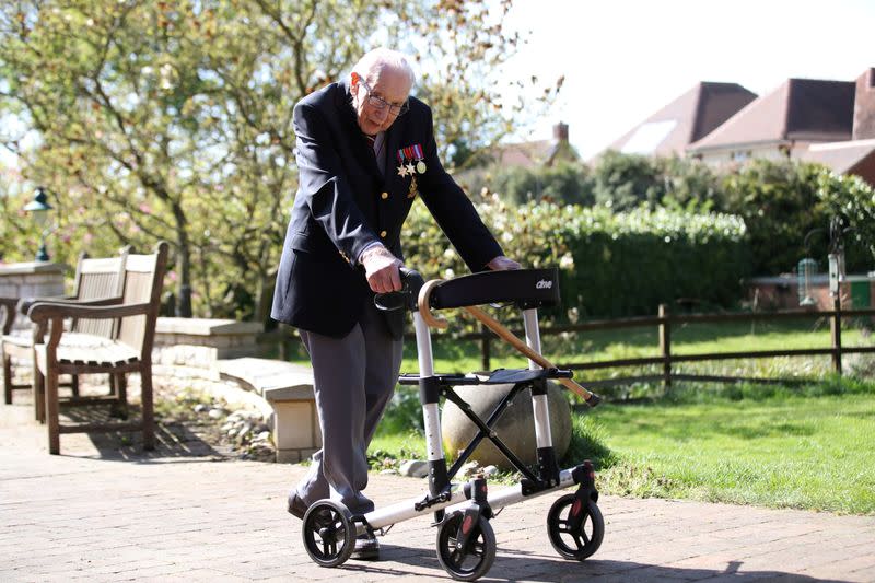 FILE PHOTO: Retired British Army Captain Moore walks to raise money for health workers