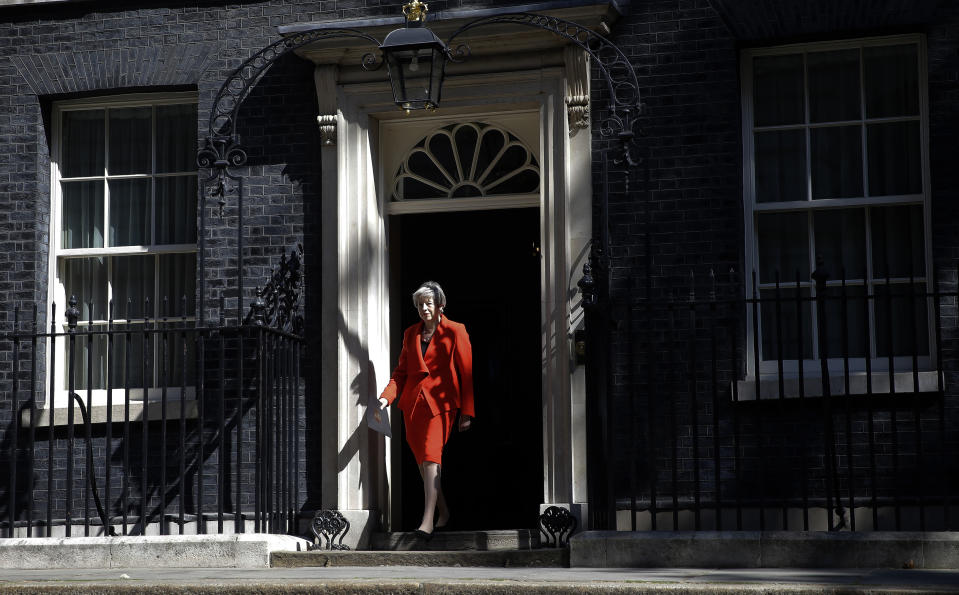 British Prime Minister Theresa May walks walks out to make a speech outside 10 Downing Street in London, England, Friday, May 24, 2019. May says she'll quit as UK Conservative leader on June 7, sparking contest for Britain's next prime minister. (AP Photo/Alastair Grant)