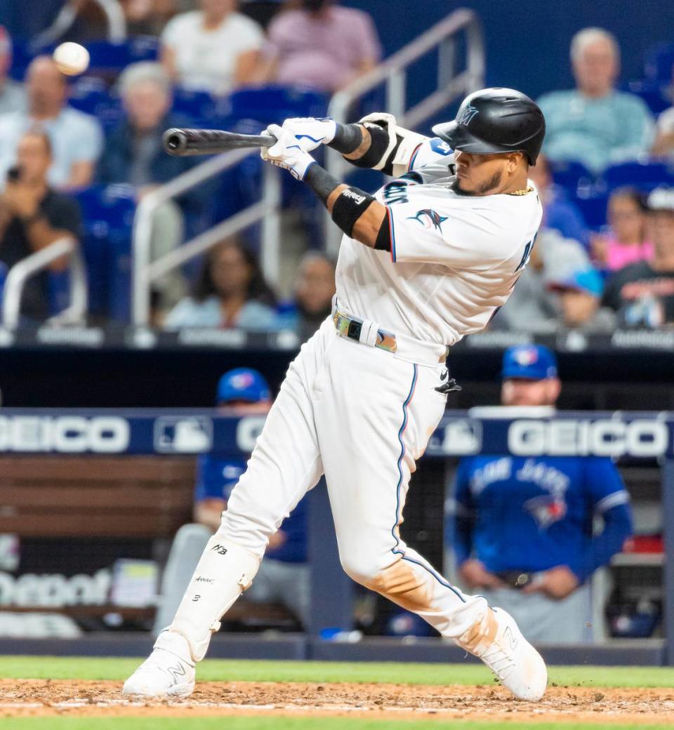 Miami Marlins second baseman Luis Arraez (3) singles on a line drive to left field against the Toronto Blue Jays in the seventh inning of an MLB game at loanDepot park on Monday, June 19, 2023, in Miami, Fla.