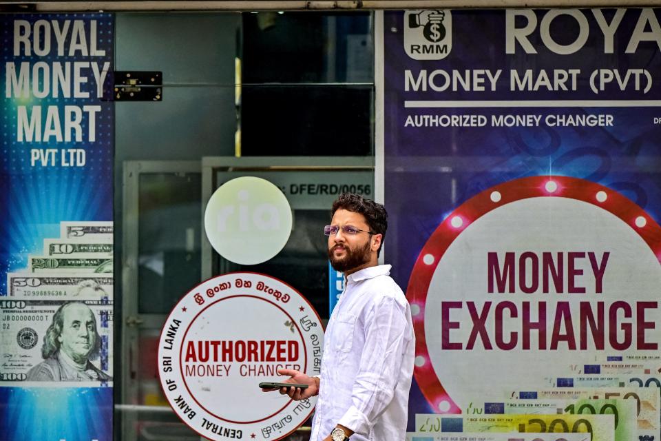 A man walks past a money exchange shop in Colombo, Sri Lanka on June 26, 2024.