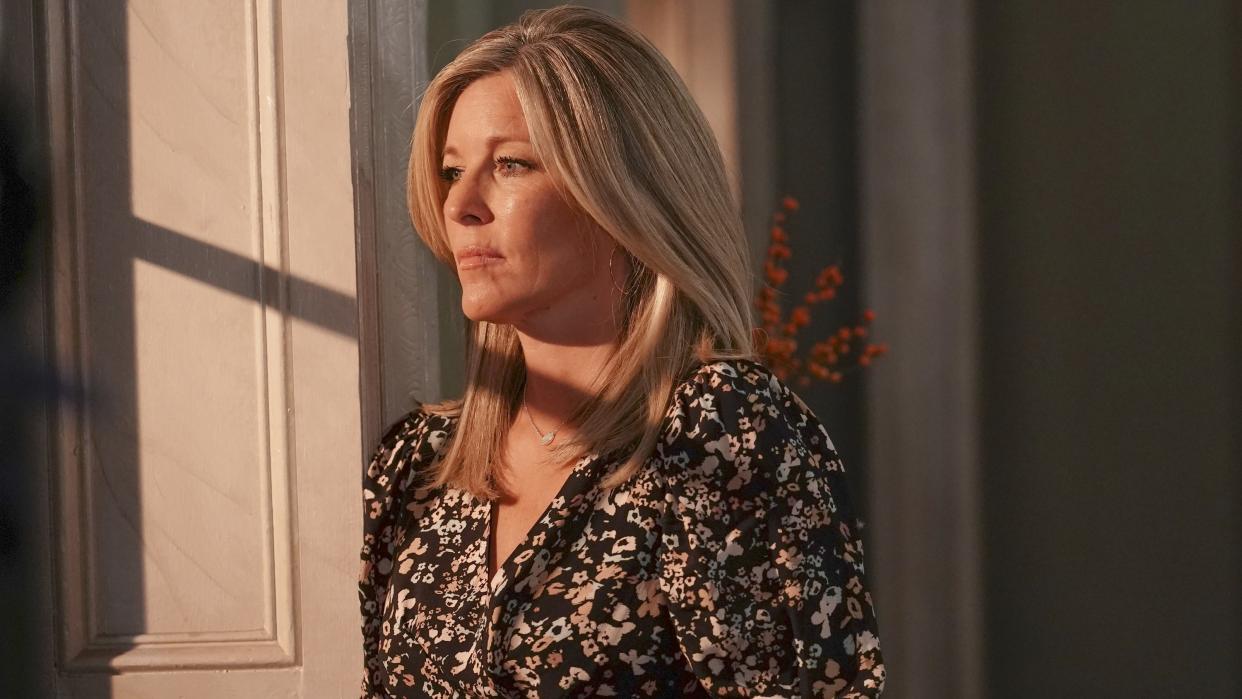  Laura Wright as Carly looking out of a window in General Hospital. 