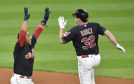 Sep 14, 2017; Cleveland, OH, USA; Cleveland Indians right fielder Jay Bruce (32) is congratulated by designated hitter Edwin Encarnacion (10) after his game-winning, RBI single in the tenth inning against the Kansas City Royals at Progressive Field. Mandatory Credit: David Richard-USA TODAY Sports