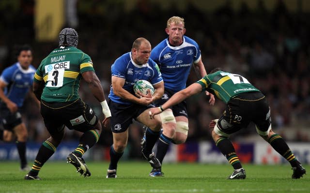 Leinster’s Richard Strauss runs into the tackle of Northampton’s Phil Dowson during the Heineken Cup final in Cardiff