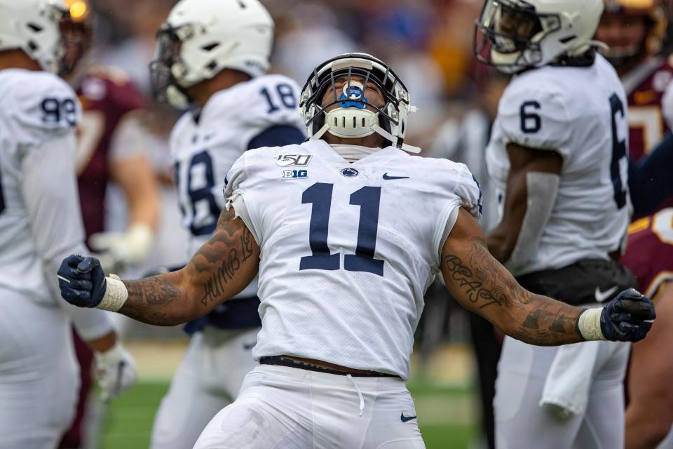 Nov 9, 2019; Minneapolis, MN, USA; Penn State Nittany Lions linebacker Micah Parsons (11) celebrates after sacking the Minnesota Golden Gophers quarterback Tanner Morgan (not pictured) in the second half at TCF Bank Stadium. Mandatory Credit: Jesse Johnson-USA TODAY Sports