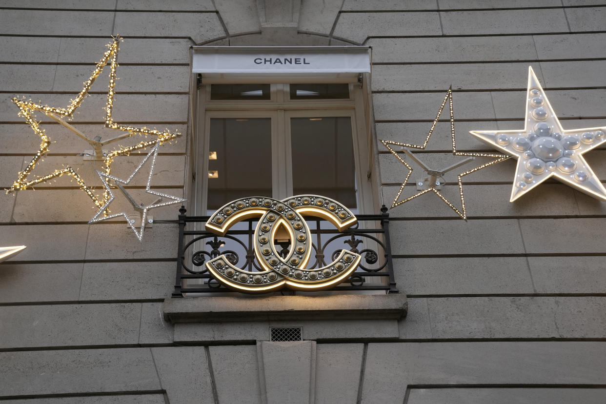 Christmas lights are pictured at a Chanel boutique Wednesday, Dec. 15, 2021 in Paris. The luxury fashion house Chanel has chosen Leena Nair, an industry outsider from India and longtime executive at Unilever, to be its new CEO. (AP Photo/Christophe Ena)