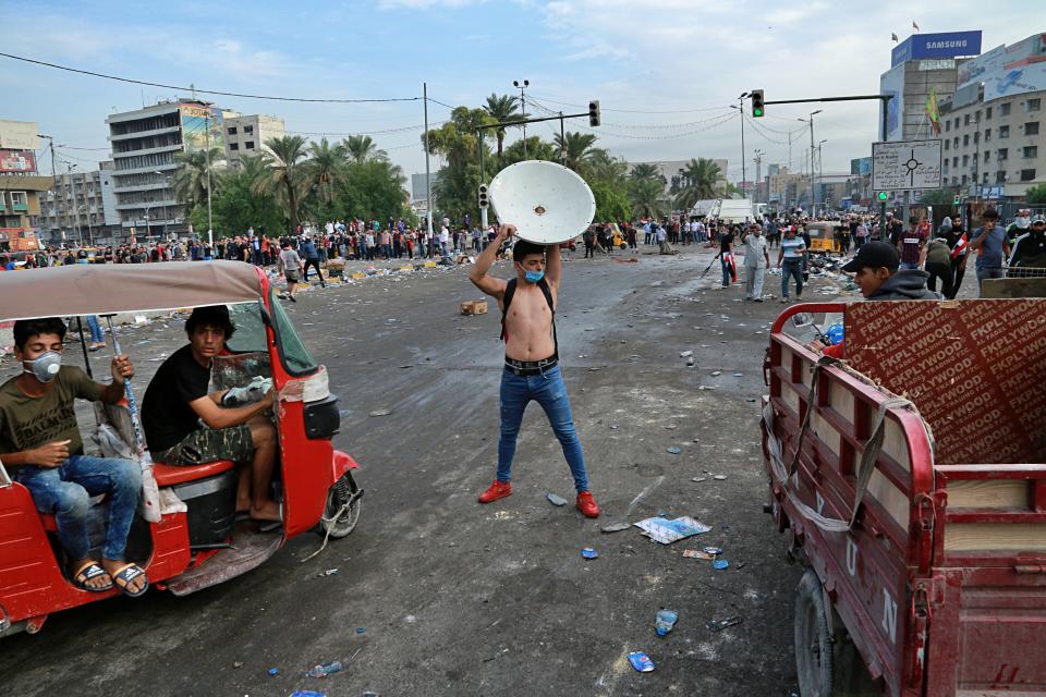 Anti-government protesters gather in Tahrir square during a demonstration in Baghdad, Iraq, Sunday, Oct. 27, 2019. Protests have resumed in Iraq after a wave of anti-government protests earlier this month were violently put down. At least 149 people were killed in a week of demonstrations earlier in October. (AP Photo/Hadi Mizban)