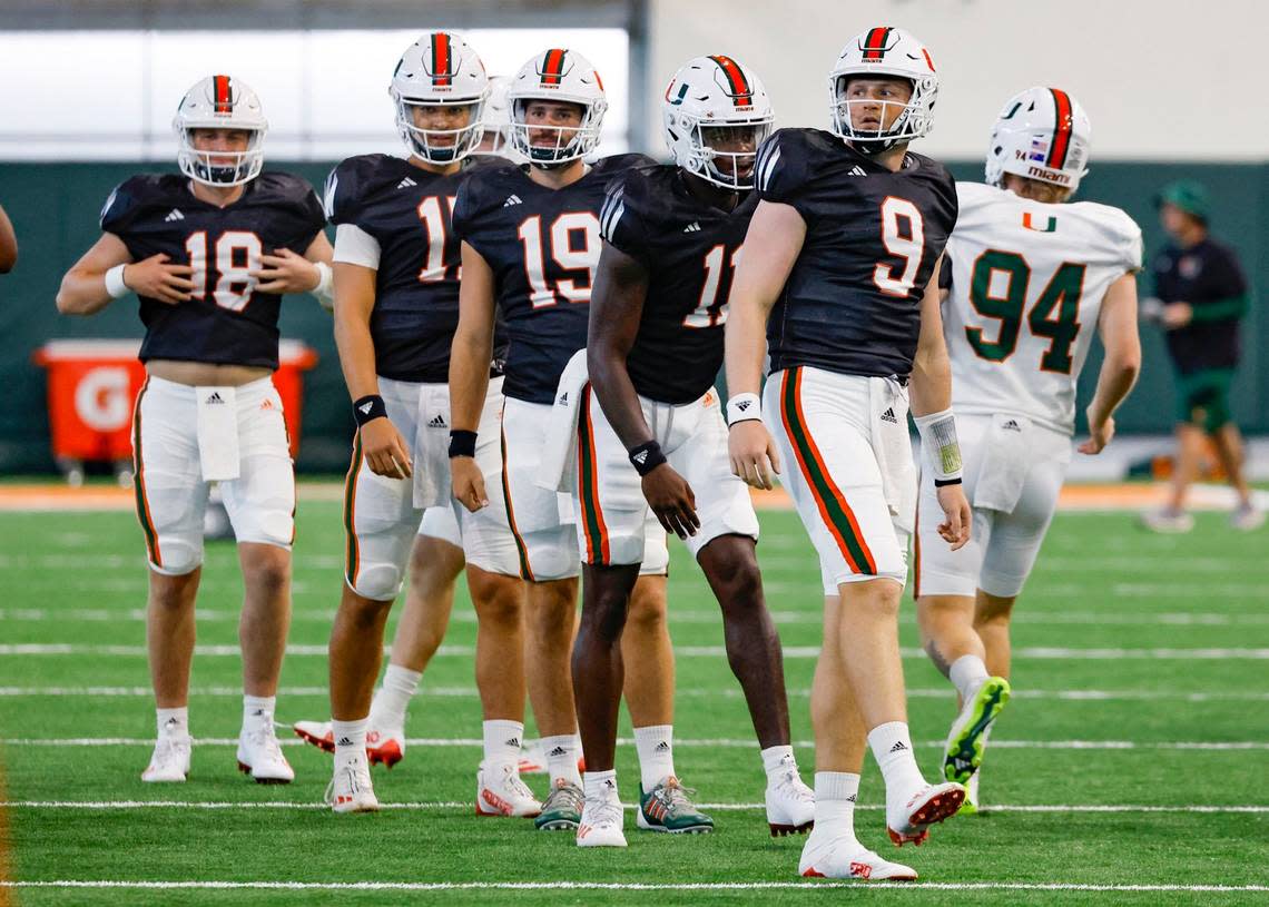 Miami Hurricanes quarterback Tyler Van Dyke leads the team during warmups at the Carol Soffer Indoor Practice Facility at the University of Miami in Coral Gables on Wednesday, August 9, 2023.