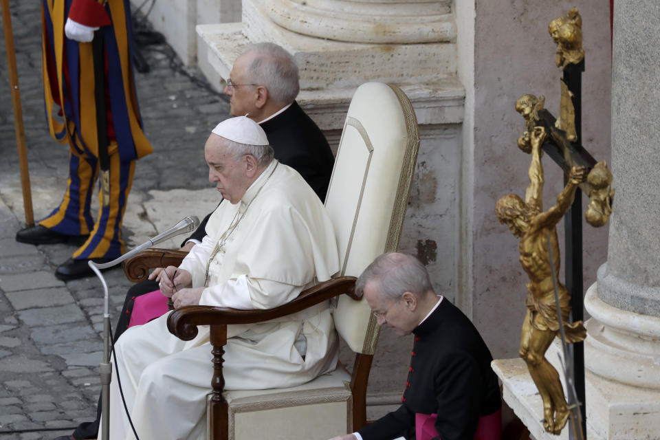 Pope Francis, center, sits during his general audience, the first with faithful since February when the coronavirus outbreak broke out, at the San Damaso courtyard, at the Vatican, Wednesday, Sept. 2, 2020. (AP Photo/Andrew Medichini)