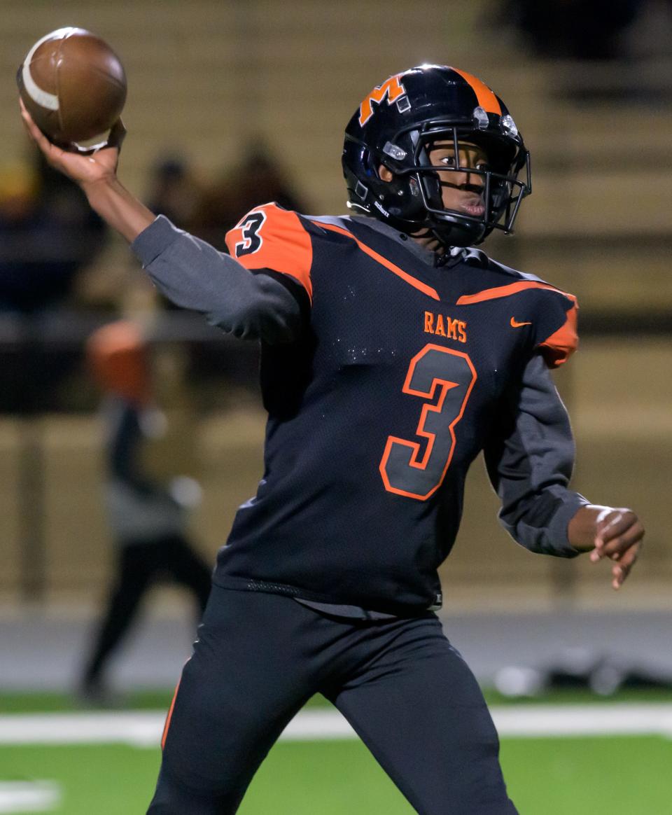 Manual quarterback Amare Breedlove throws a pass against Richwoods in the first half of their Week 7 football game Friday, Oct. 6, 2023 at Peoria Stadium.