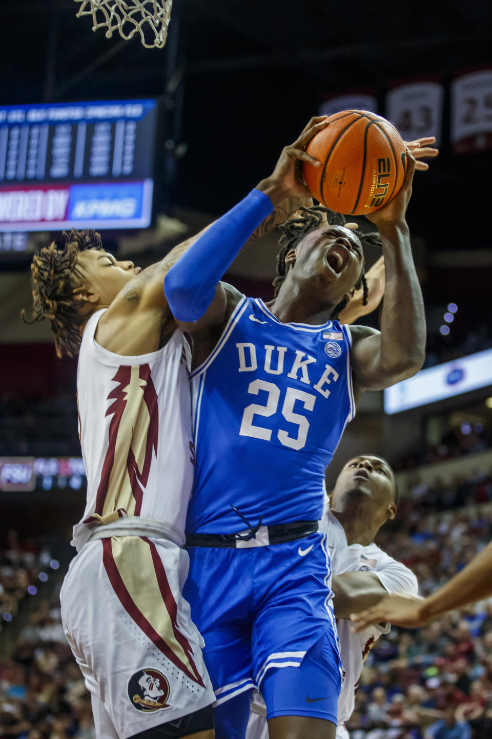 Florida State forward Cam Corhen (3) gets between Duke forward Mark Mitchell (25) and the basket during the first half of an NCAA college basketball game, Saturday, Feb. 17, 2024, in Tallahassee, Fla. (AP Photo/Colin Hackley)