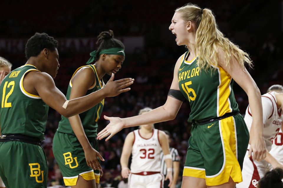 Baylor forward Lauren Cox (15) celebrates with teammate Moon Ursin in the second half of an NCAA college basketball game against Oklahoma in Norman, Okla., Saturday, Jan. 4, 2020. (AP Photo/Sue Ogrocki)