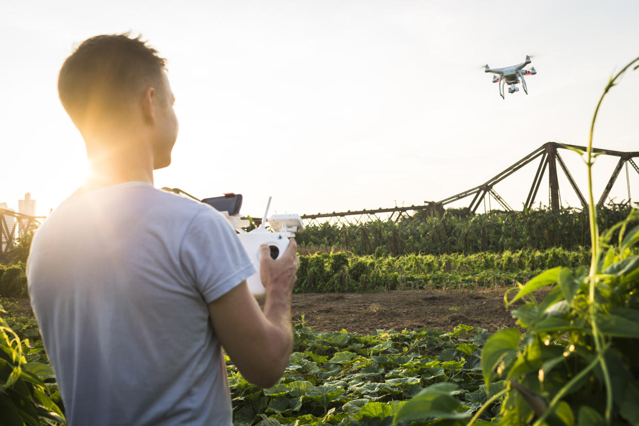 Tourist flying drone near Long Bien bridge