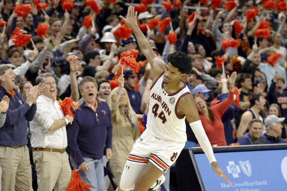 Auburn center Dylan Cardwell celebrates after a basket during the first half of an NCAA college basketball game against Texas A&M Tuesday, Jan. 9, 2024, in Auburn, Ala. (AP Photo/Butch Dill)