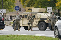 The Ohio National Guard directs traffic away from the debate hall, Tuesday, Sept. 29, 2020, in Cleveland. The first presidential debate between Republican candidate President Donald Trump and Democratic candidate and former Vice President Joe Biden is being held in Cleveland Tuesday. (AP Photo/Tony Dejak)