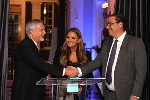 American Humane board member and retired U.S. Navy Rear Admiral Tom Kearney and American Humane CEO Dr. Robin Ganzert present Dr. Jon Paul Rodríguez with the inaugural Kiessling Prize in Washington, D.C.