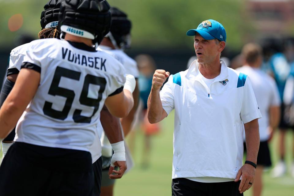 Jacksonville Jaguars defensive tackle Raymond Vohasek (59) fist bumps general manager Trent Baalke Monday, Aug. 14, 2023 at Miller Electric Center at EverBank Stadium in Jacksonville, Fla. Today was the 14th training camp session. 