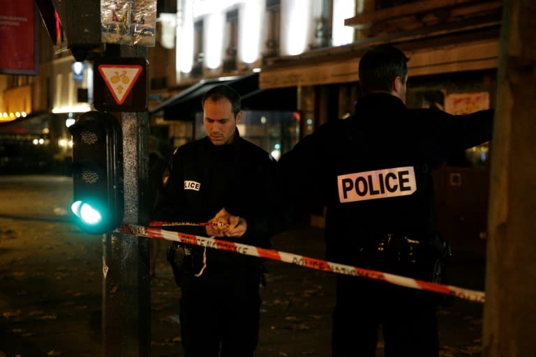 French police set up a cordon outside the building where British photographer David Hamilton was found dead at his home in Paris late on November 25, 2016