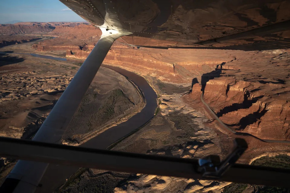 The North Wash boat ramp (center, right of river) on the Colorado River, near Hite, Utah, pictured on June 10, 2022. The way Lake Powell has receded has limited takeout points for river rafters.