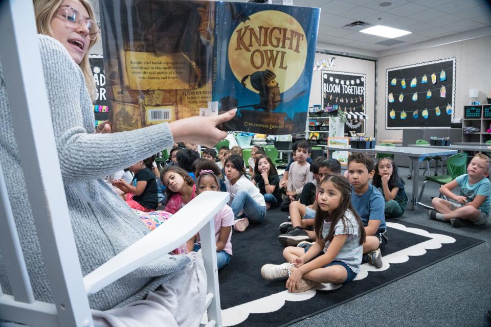 Student teacher Mary Pierce reads to the kindergartners at Stevenson Elementary on April 15, 2024, in Mesa, Arizona.