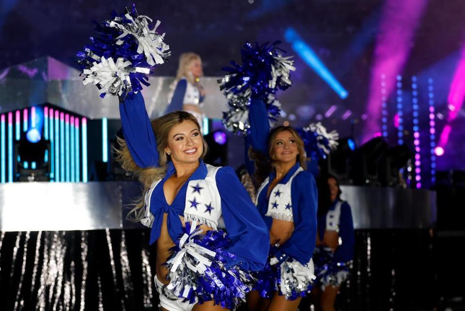 The Dallas Cowboys Cheerleaders perform with Dolly Parton during the Dallas Cowboys’ halftime show to kickoff the Red Kettle Campaign on Thursday, November 23, 2023, at AT&T Stadium in Arlington. Amanda McCoy/amccoy@star-telegram.com