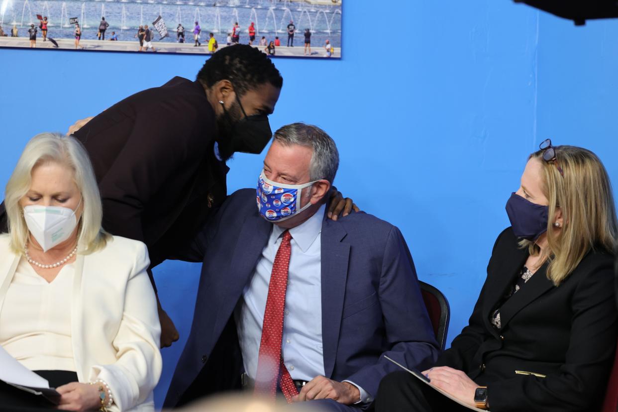 With Sen. Kirsten Gillibrand (D-N.Y.) to the far left, New York City Public Advocate Jumaane Williams (back left) chats with former New York City Mayor Bill de Blasio (back right) at the National Action Network's (NAN) annual Martin Luther King Day event in Harlem, New York on Monday, Jan. 17, 2022.