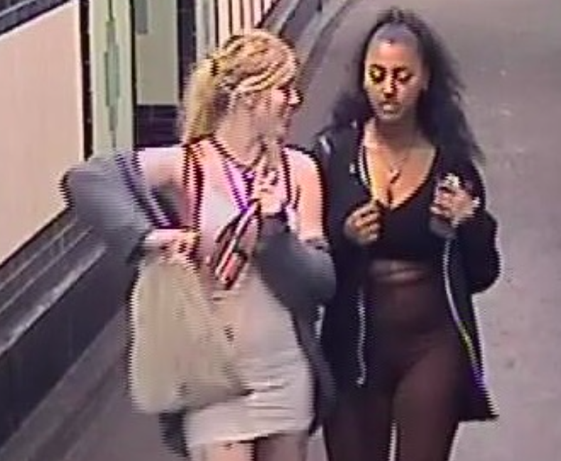 One of the women was captured on CCTV clutching a bottle. (SWNS)