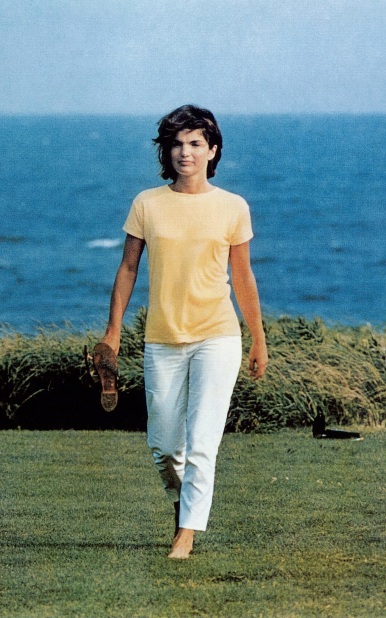 First Lady Jacqueline Kennedy wearing white chinos in Hyannis Port. - Corbis Premium Historical