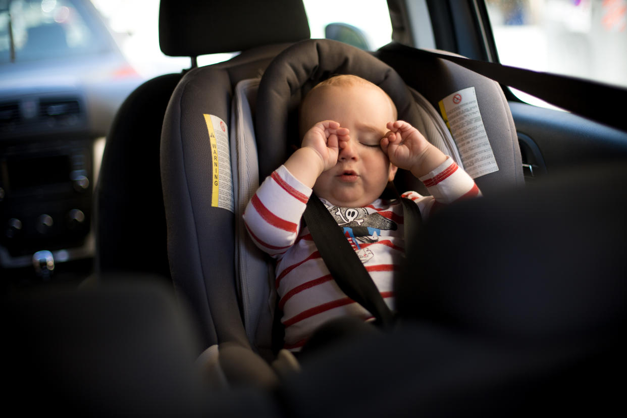 Baby in car seat.