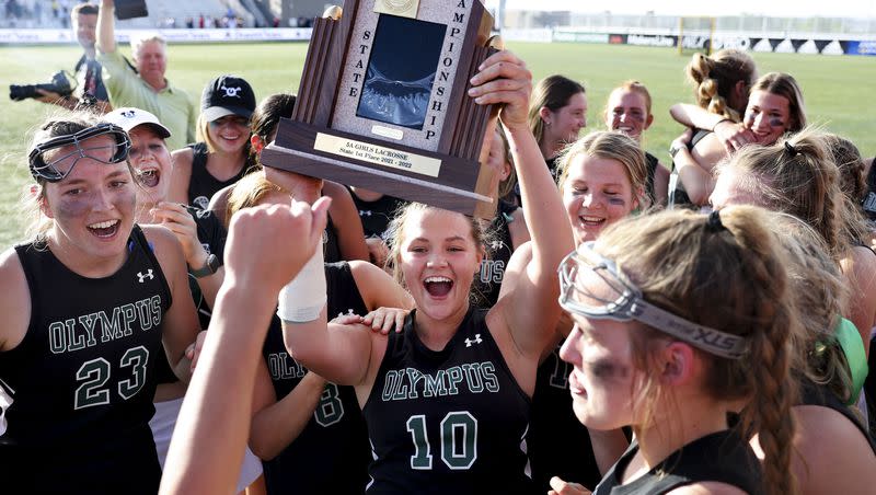Olympus celebrates their 5A championship win against Park City in the 5A girls lacrosse state championships at Zions Bank Stadium in Herriman on Thursday, May 26, 2022.
