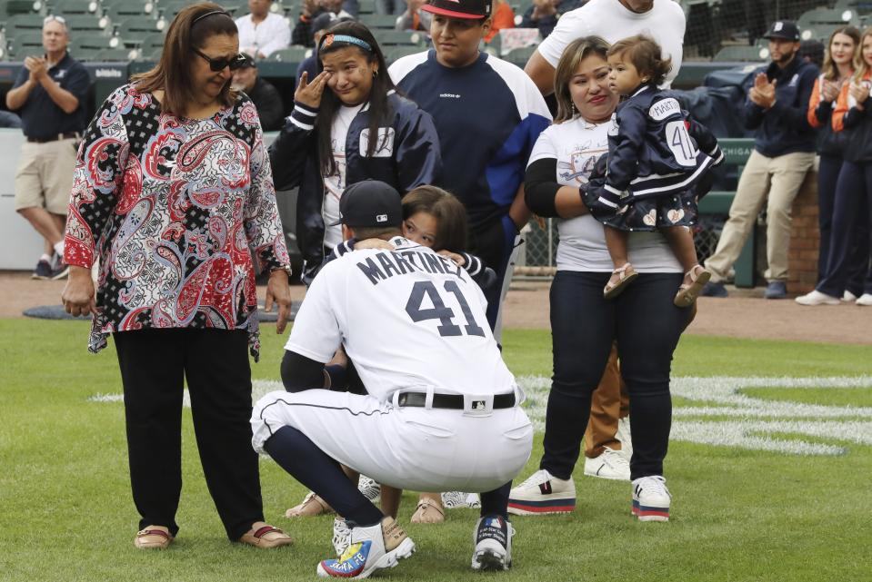 Detroit Tigers designated hitter Victor Martinez hugs a family member before a baseball game Saturday, Sept. 22, 2018, in Detroit. Martinez is playing his final game Saturday and said he wants his final at-bats to be in front of the home fans. (AP Photo/Carlos Osorio)