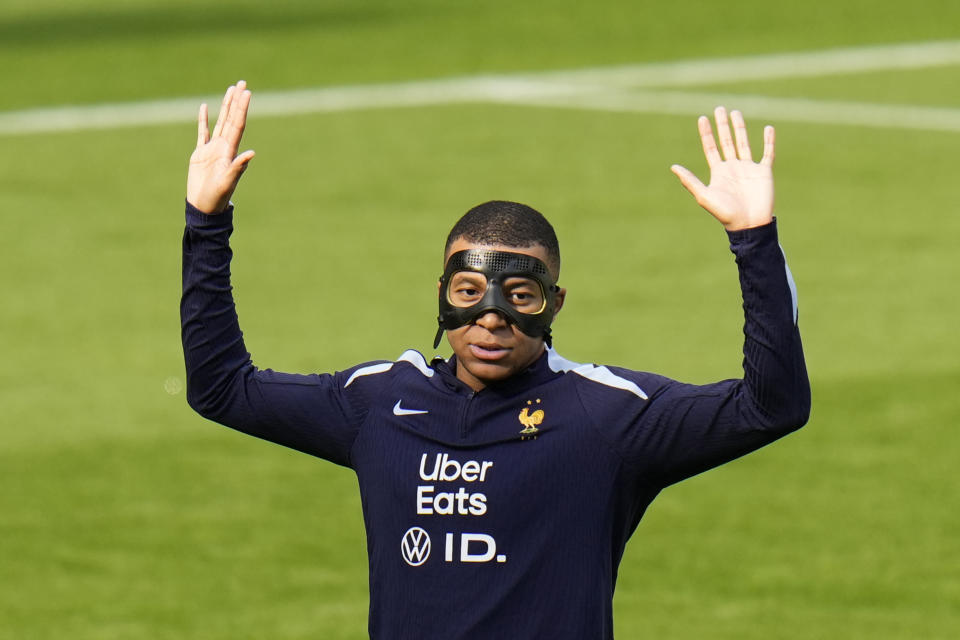 France's Kylian Mbappe gestures during a training session in Paderborn, Germany, Sunday, June 23, 2024. France will play against Poland during their Group D soccer match at the Euro 2024 soccer tournament on June 25. (AP Photo/Hassan Ammar)