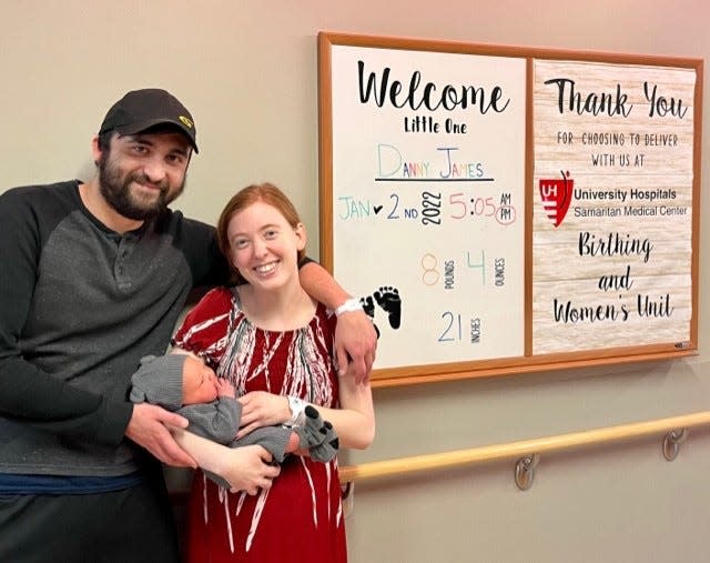 Dennis Fields, left, and Jensen Switzer cradle their newborn son. Danny James Fields. on Jan. 2 at University Hospitals Samaritan Medical Center. Danny is the first baby born at the Ashland County hospital in 2023.