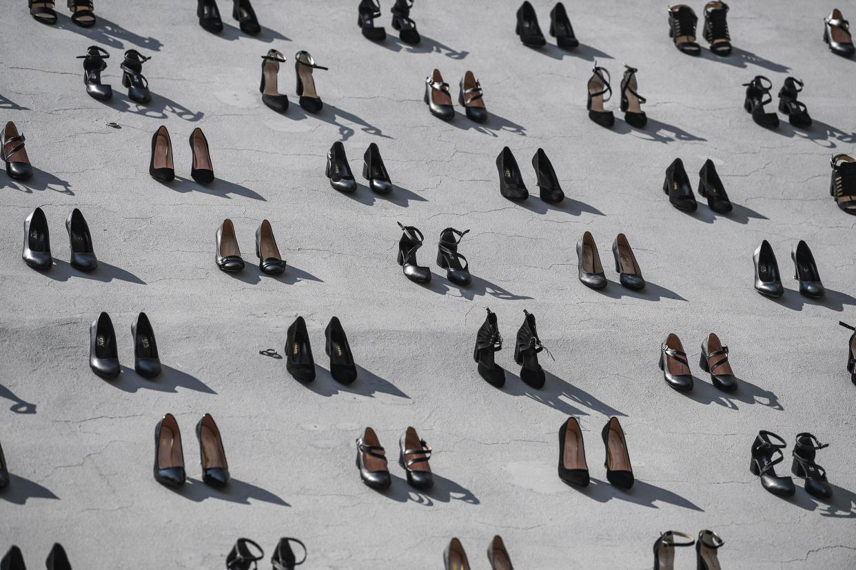 This picture taken on September 17, 2019 in Istanbul shows a contemporary art installation by Turkish artist Vahit Tuna in an attempt to raise awareness on women killed by domestic violence by their partners and husbands. - Turkish artist Vahiot Tuna placed 440 pair of female shoes on the walls of a building to symbolize women killed by their partners and husbands in 2018 in Turkey. (Photo by Ozan KOSE / AFP) / RESTRICTED TO EDITORIAL USE - MANDATORY MENTION OF THE ARTIST UPON PUBLICATION - TO ILLUSTRATE THE EVENT AS SPECIFIED IN THE CAPTION        (Photo credit should read OZAN KOSE/AFP/Getty Images)