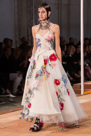 <p>Francois Durand/Getty</p> Alexander McQueen Paris Fashion Week Spring/Summer 2018 runway.