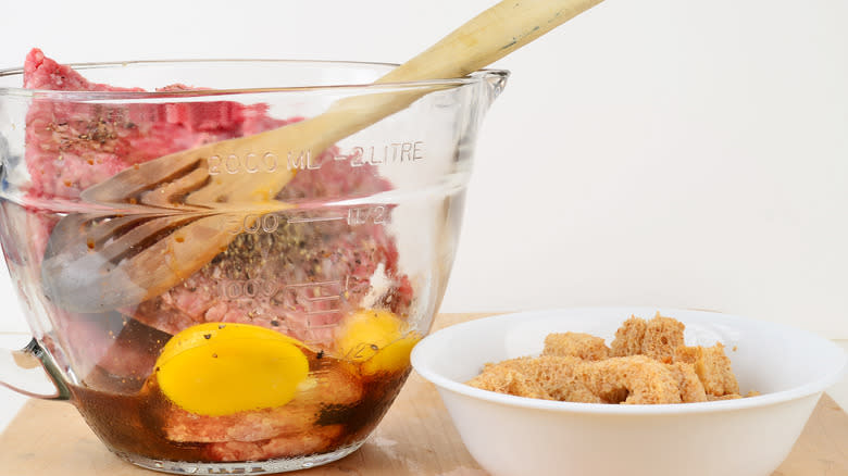 A bowl of ingredients for meatloaf