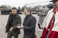 Ukrainian President Volodymyr Zelenskyy, left, is accompanied by Switzerland's Foreign Minister Federal Councillor Ignazio Cassis, after his arrival at Zurich's Kloten airport, Switzerland, Monday, Jan. 15, 2024. Zelenskyy is in Switzerland to attend the World Economic Forum in Davos starting Tuesday. (Alessandro della Valle/Keystone via AP)