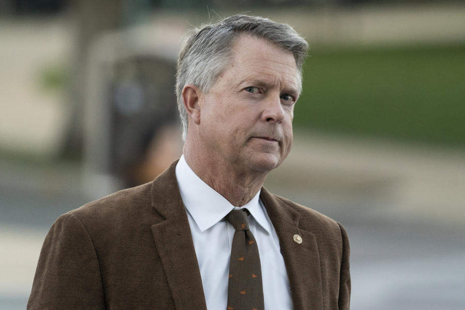 FILE - Sen. Roger Marshall, R-Kan., arrives for a vote on Capitol Hill, Nov. 1, 2021, in Washington. They are just three little words, but they have become nearly impossible for many Republicans to say: “Joe Biden won.” It's a measure of election denialism within the Republican Party. On NBC's “Meet the Press” on Sunday, Marshall would only concede: “Joe Biden was sworn into office. (AP Photo/Alex Brandon, File)