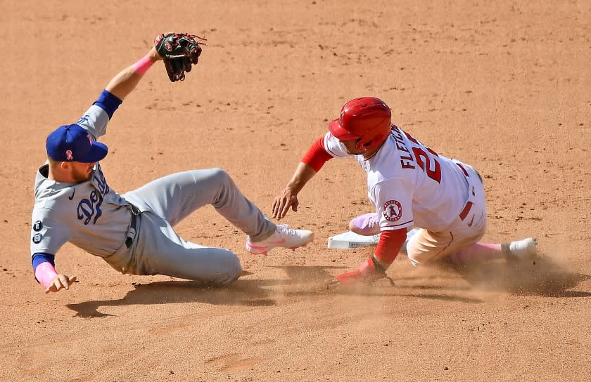 ANAHEIM, CALIFORNIA MAY 9, 2021-Dodgers 2nd baseman Gavin Lux can't catch the relay throw to 2nd base.