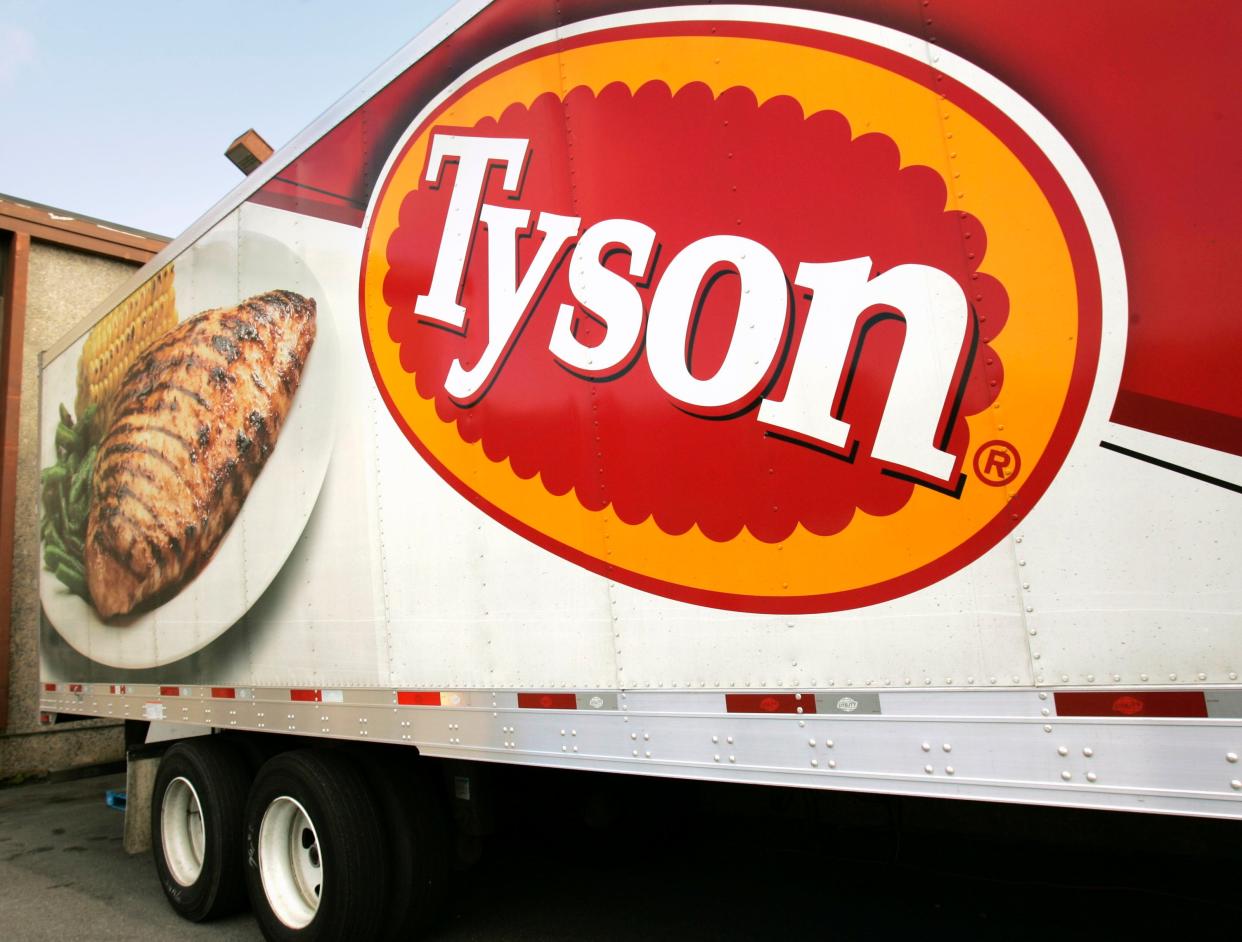 big Tyson truck with company logo and photo of chicken on white plate with corn and green beans